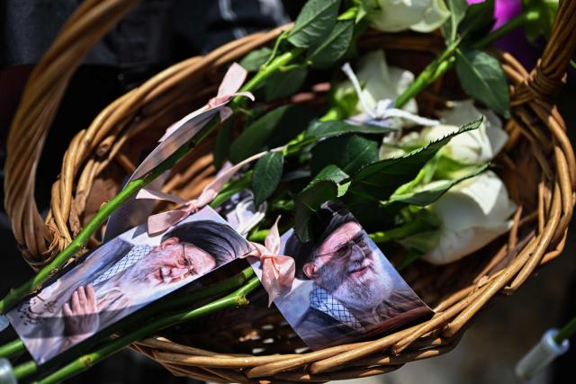 Flowers with portraits of Iran's slain supreme leader Ayatollah Ali Khamenei are seen during a demonstration to mark al-Quds (Jerusalem) Day, after Friday prayers in Kuala Lumpur on March 13, 2026. (Photo by Mohd Rasfan / AFP)