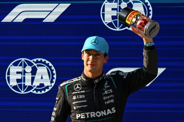 Mercedes' British driver George Russell celebrates getting pole position in the sprint qualifying session ahead of the Formula One Chinese Grand Prix at the Shanghai International Circuit in Shanghai on March 13, 2026. (Photo by JADE GAO / AFP)