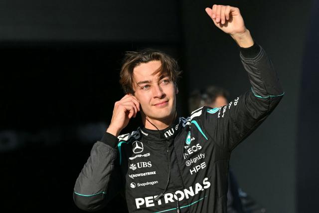 Mercedes' British driver George Russell celebrates getting pole position in the sprint qualifying session ahead of the Formula One Chinese Grand Prix at the Shanghai International Circuit in Shanghai on March 13, 2026. (Photo by HECTOR RETAMAL / AFP)