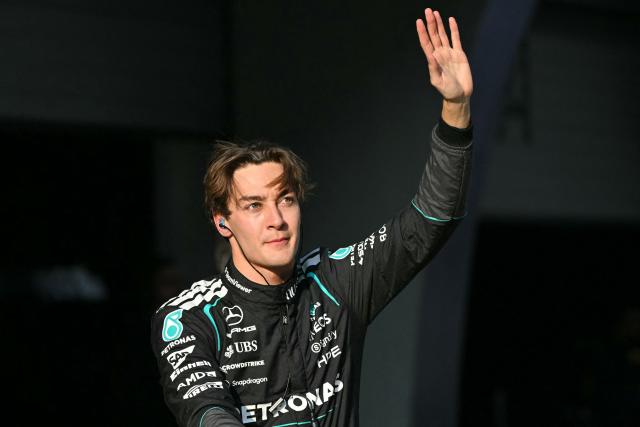Mercedes' British driver George Russell celebrates getting pole position in the sprint qualifying session ahead of the Formula One Chinese Grand Prix at the Shanghai International Circuit in Shanghai on March 13, 2026. (Photo by HECTOR RETAMAL / AFP)