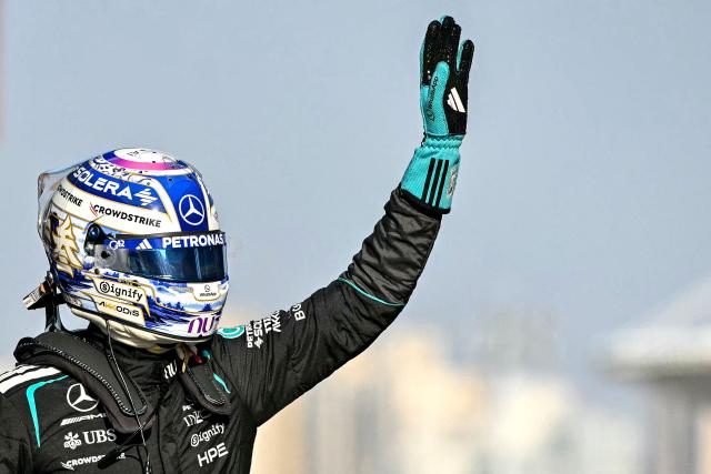 Mercedes' British driver George Russell celebrates getting pole position in the sprint qualifying session ahead of the Formula One Chinese Grand Prix at the Shanghai International Circuit in Shanghai on March 13, 2026. (Photo by HECTOR RETAMAL / AFP)