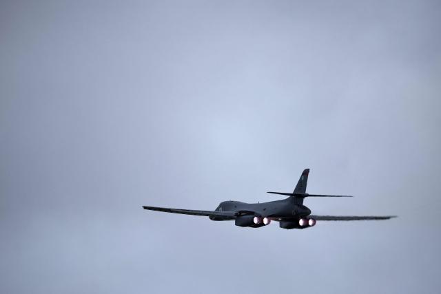 A US Air Force B-1 Lancer bomber takes off from RAF Fairford in south-west England on March 13, 2026. Fairford is one of two bases, along with the Diego Garcia facility in the Indian Ocean, that the UK has given the US permission to use for "specific defensive operations into Iran" to destroy Iranian missiles at source, the British defence minister said in a statement. (Photo by Henry NICHOLLS / AFP)