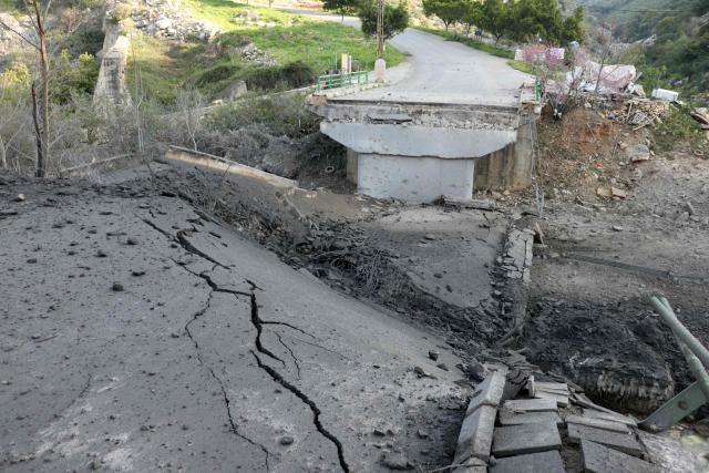 A picture shows the destroyed Tayr Filsay bridge connecting the villages located south of the Litani with those on the northern side of the river after it was targeted by an Israeli air strike on March 13, 2026. Fresh strikes rocked Iran and several Gulf countries on March 13, as Israel and the Islamic republic unleashed a new wave of attacks in a war that has ignited the Middle East and threatens to torpedo the world economy. The conflict has heavily impacted Lebanon, where authorities reported 687 people killed by Israeli attacks. (Photo by Kawnat HAJU / AFP)