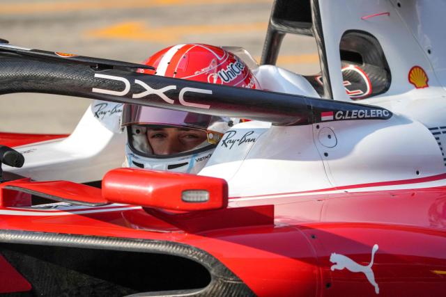 Ferrari's Monegasque driver Charles Leclerc drives in the pits during the sprint qualifying session ahead of the Formula One Chinese Grand Prix at the Shanghai International Circuit in Shanghai on March 13, 2026. (Photo by Andy WONG / POOL / AFP)