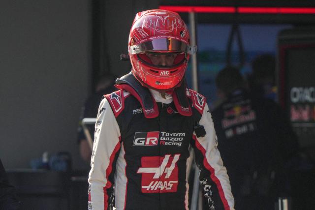 Haas F1 Team's French driver Esteban Ocon walks in the pits during the sprint qualifying session ahead of the Formula One Chinese Grand Prix at the Shanghai International Circuit in Shanghai on March 13, 2026. (Photo by Andy WONG / POOL / AFP)