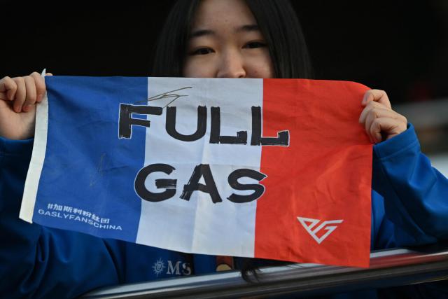 A fans of Alpine's French driver Pierre Gasly is seen during the sprint qualifying session ahead of the Formula One Chinese Grand Prix at the Shanghai International Circuit in Shanghai on March 13, 2026. (Photo by Hector RETAMAL / AFP)