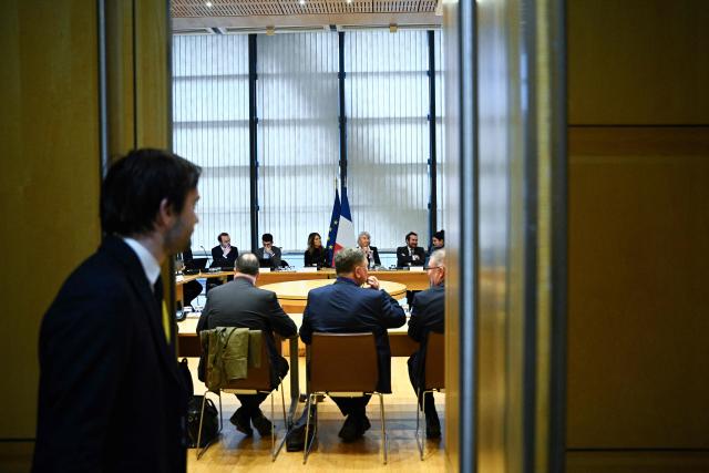 France's Government Spokesperson Maud Bregeon (C-L) and France’s junior Minister in charge of the sea and fisheries Catherine Chabaud (C-R) prepare during a meeting with representatives of the fishing industry, banking institutions and energy companies regarding the international situation at the French Economy and Finance Ministry in Paris on March 13, 2026. In response to Bercy’s overtures, the pledge by several retailers to ease French consumers’ bills was already in serious trouble on March 12, 2026, following a fresh rise in oil prices amid the war in the Middle East. (Photo by JULIEN DE ROSA / AFP)