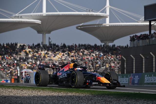 Red Bull Racing's Dutch driver Max Verstappen drives during the sprint qualifying session ahead of the Formula One Chinese Grand Prix at the Shanghai International Circuit in Shanghai on March 13, 2026. (Photo by GREG BAKER / AFP)