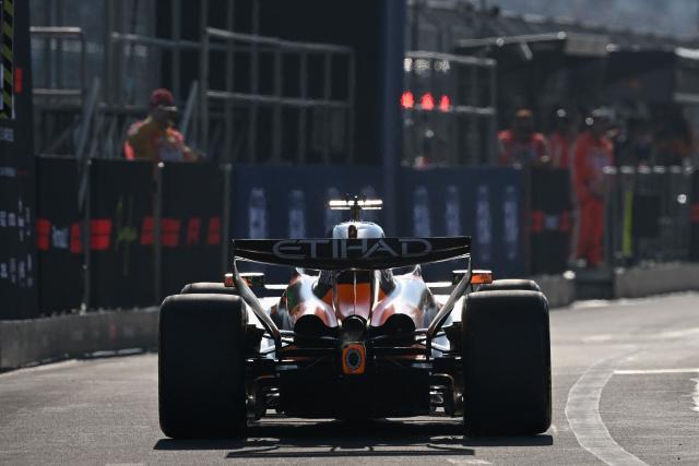 McLaren's British driver Lando Norris heads into the pit lane during the sprint qualifying session ahead of the Formula One Chinese Grand Prix at the Shanghai International Circuit in Shanghai on March 13, 2026. (Photo by GREG BAKER / AFP)