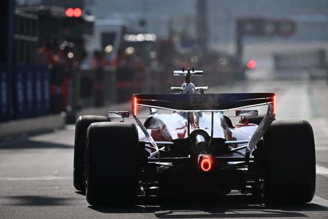 Ferrari's Monegasque driver Charles Leclerc drives into the pit lane during the sprint qualifying session ahead of the Formula One Chinese Grand Prix at the Shanghai International Circuit in Shanghai on March 13, 2026. (Photo by GREG BAKER / AFP)