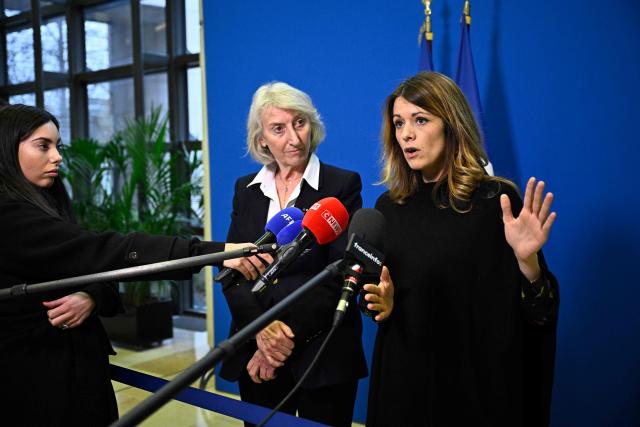 France's Government Spokesperson Maud Bregeon (R) accompanied by France’s junior Minister in charge of the sea and fisheries Catherine Chabaud (C) addresses media following a meeting with representatives of the fishing industry, banking institutions and energy companies regarding the international situation at the French Economy and Finance Ministry in Paris on March 13, 2026. In response to Bercy’s overtures, the pledge by several retailers to ease French consumers’ bills was already in serious trouble on March 12, 2026, following a fresh rise in oil prices amid the war in the Middle East. (Photo by JULIEN DE ROSA / AFP)