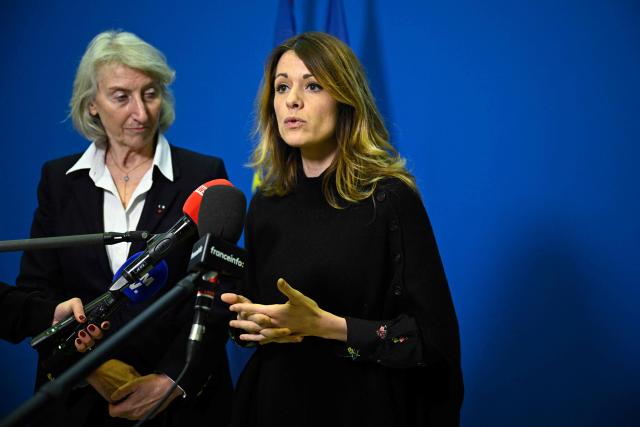 France's Government Spokesperson Maud Bregeon (R) accompanied by France’s junior Minister in charge of the sea and fisheries Catherine Chabaud (L) addresses media following a meeting with representatives of the fishing industry, banking institutions and energy companies regarding the international situation at the French Economy and Finance Ministry in Paris on March 13, 2026. In response to Bercy’s overtures, the pledge by several retailers to ease French consumers’ bills was already in serious trouble on March 12, 2026, following a fresh rise in oil prices amid the war in the Middle East. (Photo by JULIEN DE ROSA / AFP)