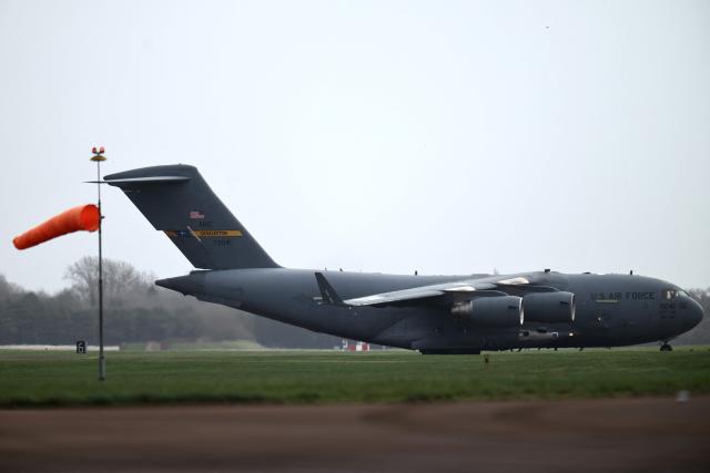 A US Air Force C-17 Globemaster III lands at RAF Fairford in south-west England on March 13, 2026. Fairford is one of two bases, along with the Diego Garcia facility in the Indian Ocean, that the UK has given the US permission to use for "specific defensive operations into Iran" to destroy Iranian missiles at source, the British defence minister said in a statement. (Photo by Henry NICHOLLS / AFP)