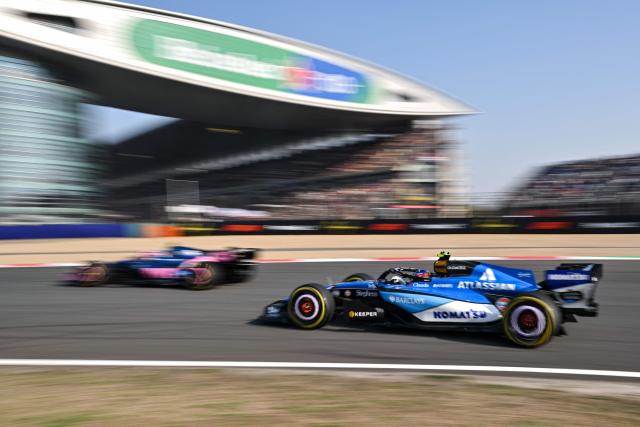 Williams' Spanish driver Carlos Sainz (R) drives during the sprint qualifying session ahead of the Formula One Chinese Grand Prix at the Shanghai International Circuit in Shanghai on March 13, 2026. (Photo by Hector RETAMAL / AFP)