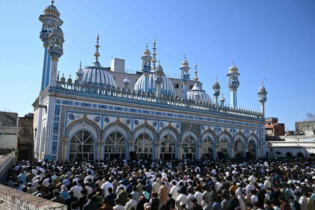 Muslim devotees offer their last Friday prayers of the Islamic holy fasting month of Ramadan, in Rawalpindi on March 13, 2026. (Photo by Farooq Naeem / AFP)