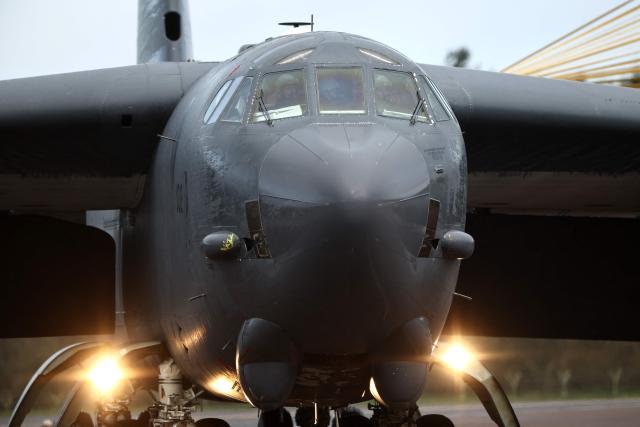 A US Air Force B-52 Stratofortress bomber lands at RAF Fairford in south-west England on March 13, 2026. Fairford is one of two bases, along with the Diego Garcia facility in the Indian Ocean, that the UK has given the US permission to use for "specific defensive operations into Iran" to destroy Iranian missiles at source, the British defence minister said in a statement. (Photo by Henry NICHOLLS / AFP)