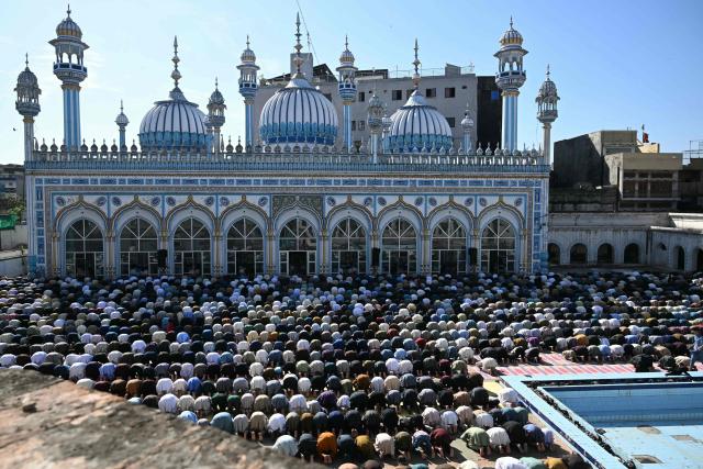 Muslim devotees offer their last Friday prayers of the Islamic holy fasting month of Ramadan, in Rawalpindi on March 13, 2026. (Photo by Farooq Naeem / AFP)