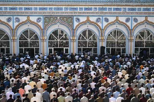 Muslim devotees offer their last Friday prayers of the Islamic holy fasting month of Ramadan, in Rawalpindi on March 13, 2026. (Photo by Farooq Naeem / AFP)