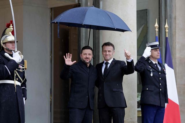 France's President Emmanuel Macron (R) welcomes Ukraine's President Volodymyr Zelensky before a meeting at The Elysee Presidential Palace in Paris on March 13, 2026. (Photo by Ludovic MARIN / AFP)