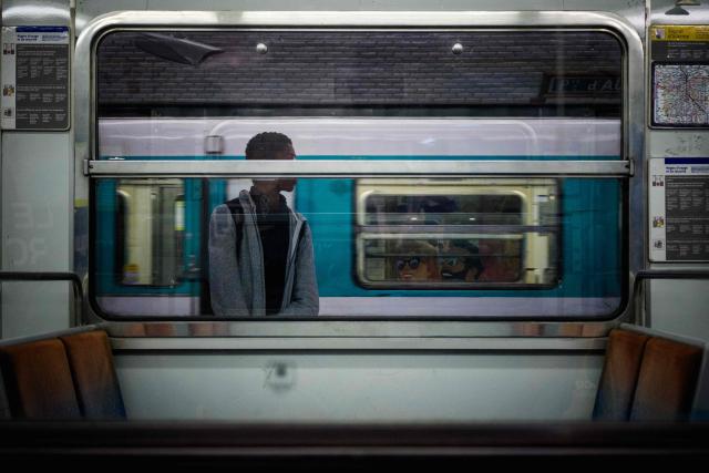 (FILES) A commuter waits for the new Alstom MF19 on metro line 10 on the day of its opening, as part of RATP modernisation work, at the Porte dAuteuil station, in Paris on October 16, 2025. The RATP Group returned to profit in 2025, after the adjustment of the compensation paid by the Île-de-France region and a productivity effort, but passenger traffic, although higher than in 2024, remains below its pre-pandemic level announced the new President of Autonomous Management of Parisian Transport (RATP - Regie Autonome des Transports Parisiens) on March 13, 2026. (Photo by Dimitar DILKOFF / AFP)