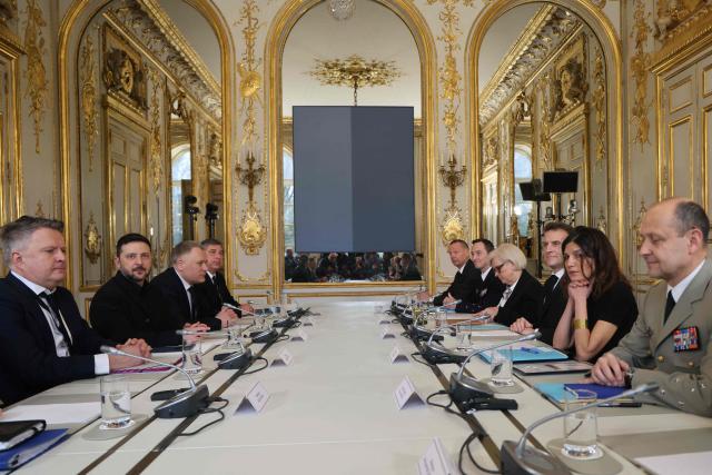 France's President Emmanuel Macron (3rd R) and Ukraine's President Volodymyr Zelensky (2nd L) attend a bilateral meeting at The Elysee Presidential Palace in Paris on March 13, 2026. (Photo by Ludovic MARIN / POOL / AFP)