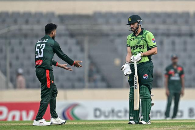 Pakistan's Salman Agha (R) speaks with Bangladesh's captain Mehidy Hasan Miraz after his dismissal during the second one-day international (ODI) cricket match between Bangladesh and Pakistan at Sher-e-Bangla National Stadium in Mirpur on March 13, 2026. (Photo by Munir UZ ZAMAN / AFP)