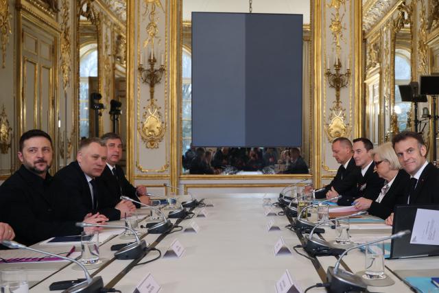 France's President Emmanuel Macron (R) and Ukraine's President Volodymyr Zelensky (L) attend a bilateral meeting at The Elysee Presidential Palace in Paris on March 13, 2026. (Photo by Ludovic MARIN / POOL / AFP)