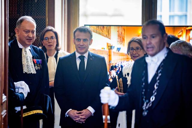 France's President Emmanuel Macron (C) attends the investiture ceremony of newly appointed French Court of Auditors president Amelie de Montchalin (unseen) at the Court of Auditors headquarters in Paris, on March 13, 2026. (Photo by Christophe PETIT TESSON / POOL / AFP)