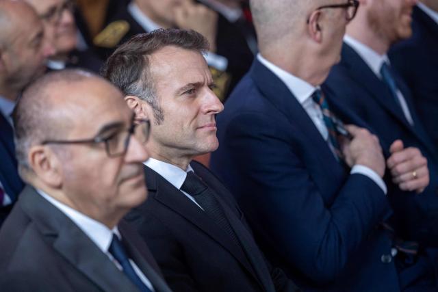 France's President Emmanuel Macron (C) attends the investiture ceremony of newly appointed French Court of Auditors president Amelie de Montchalin (unseen) at the Court of Auditors headquarters in Paris, on March 13, 2026. (Photo by Christophe PETIT TESSON / POOL / AFP)