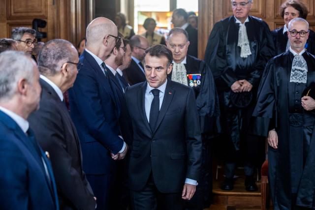 France's President Emmanuel Macron (C) attends the investiture ceremony of newly appointed French Court of Auditors president Amelie de Montchalin (unseen) at the Court of Auditors headquarters in Paris, on March 13, 2026. (Photo by Christophe PETIT TESSON / POOL / AFP)