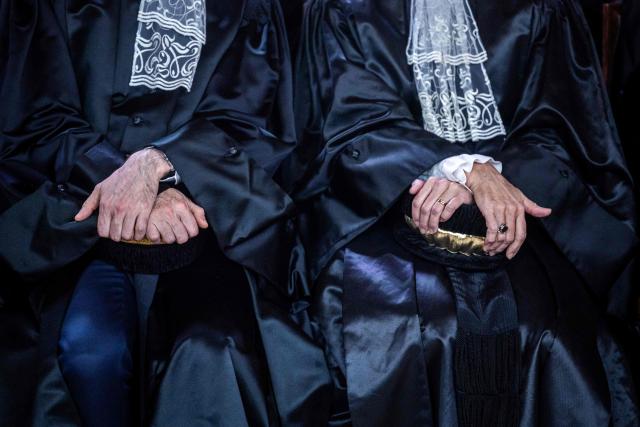Judges from the Court of Auditors attend the investiture ceremony of newly appointed French Court of Auditors president Amelie de Montchalin (unseen) at the Court of Auditors headquarters in Paris, on March 13, 2026. (Photo by Christophe PETIT TESSON / POOL / AFP)
