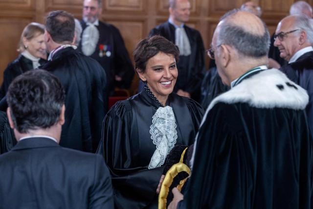 Former French Minister and  Court of Auditors judge Najat Vallaud-Belkacem (C) attends the investiture ceremony of newly appointed French Court of Auditors president Amelie de Montchalin (unseen) at the Court of Auditors headquarters in Paris, on March 13, 2026. (Photo by Christophe PETIT TESSON / POOL / AFP)