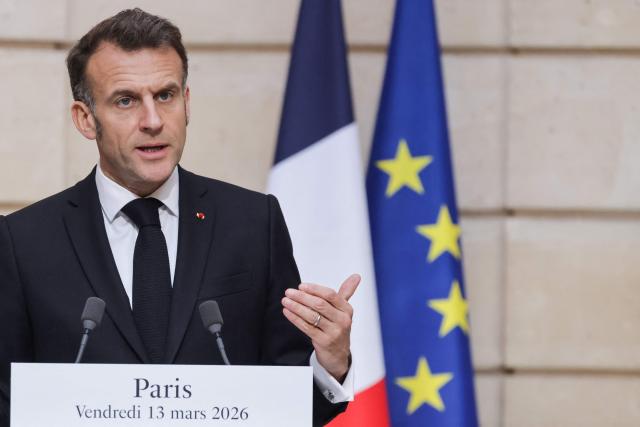 France's President Emmanuel Macron delivers a speech during a joint press conference with Ukraine's President Volodymyr Zelensky (unseen) following talks focused on the support from France and European partners to help Ukraine defend itself, and on ways to increase pressure on Russia, at the Elysee Presidential Palace in Paris on March 13, 2026. Russia's invasion of Ukraine in February 2022 sparked the bloodiest war in Europe since World War II, forcing the displacement of millions and leaving hundreds of thousands of soldiers and civilians dead on both sides. (Photo by Ludovic MARIN / POOL / AFP)