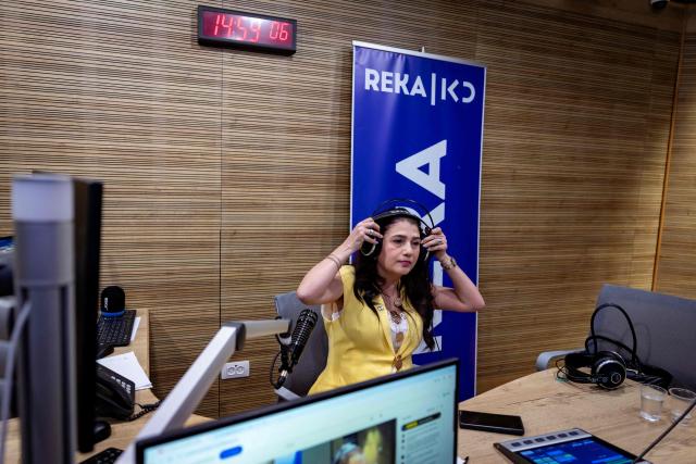 Radio presenter Sahar Saidian broadcast from the Reka Kan studio in Jerusalem on March 11, 2026. For Sahar Saidian, past and present collide every day on the airwaves as she hosts a Persian-language show on Israeli public radio for listeners in Israel and in Iran, the country she left behind years ago. "After 26 years in Israel, I look more Israeli than Iranian, but even though I left Iran, the country is still part of me," Saidian told AFP. The two countries are now at war. The Middle East conflict began on February 28 when Israel and the United States attacked Iran. (Photo by Odd ANDERSEN / AFP)