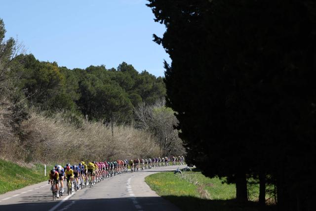 The pack rides during the 6th stage of the Paris-Nice cycling race, 179.3 km between Barbentane and Apt, on March 13, 2026. (Photo by Anne-Christine POUJOULAT / AFP)