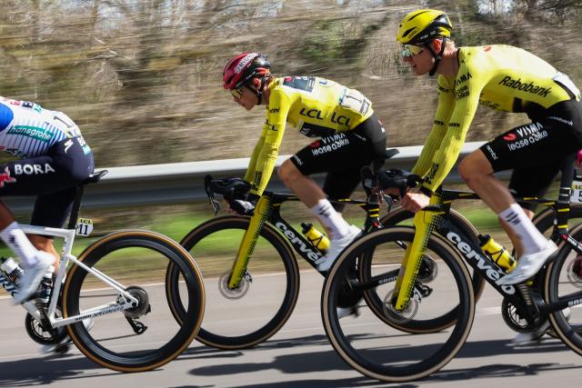TOPSHOT - Team Visma - Lease a Bike's Danish rider Jonas Vingegaard, wearing the overall leader yellow jersey, and Team Visma - Lease a Bike's Dutch rider Wilco Kelderman (R) ride with the pack during the 6th stage of the Paris-Nice cycling race, 179.3 km between Barbentane and Apt, on March 13, 2026. (Photo by Anne-Christine POUJOULAT / AFP)