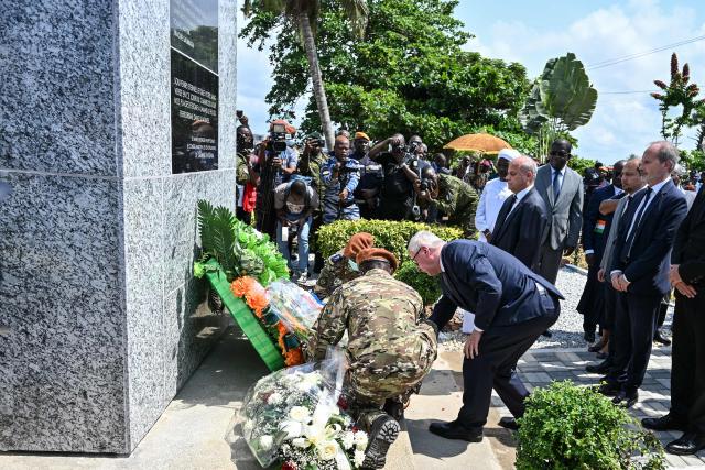 Germanys Ambassador to Ivory Coast Matthias Veltin (C), assisted by two Ivorian soldiers, lays a wreath at a memorial honouring the victims of a jihadist attack, at a beach in Grand-Bassam on March 13, 2026. Ivory Coast on March 13, 2026 commemorated the 19 victims of a jihadist attack on a popular beach resort a decade ago.
Three attackers wielding assault rifles stormed the beach at Grand-Bassam, popular with foreigners and 40 kilometres (25 miles) east of the main city of Abidjan, on March 13, 2016 before attacking restaurants. 
The 45-minute bloodbath ended when Ivorian security forces shot the attackers dead. (Photo by Sia KAMBOU / AFP)