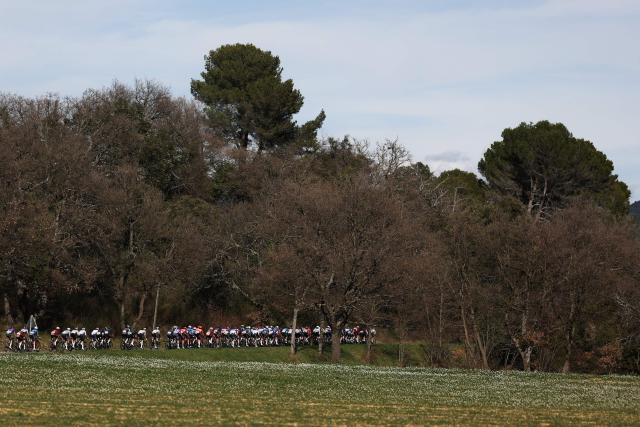 The pack rides during the 6th stage of the Paris-Nice cycling race, 179.3 km between Barbentane and Apt, on March 13, 2026. (Photo by Anne-Christine POUJOULAT / AFP)