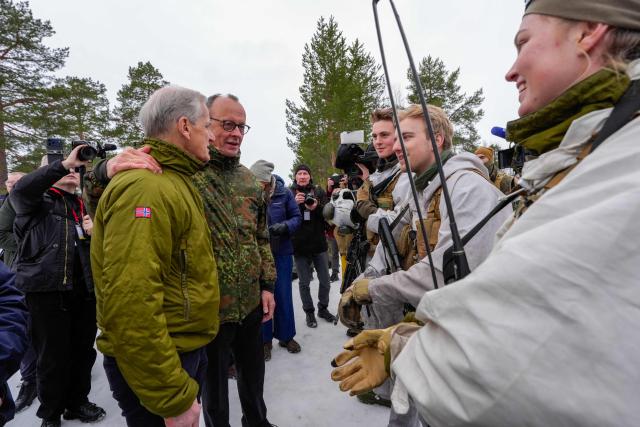 Norway's Prime Minister Jonas Gahr Stoere and German Chancellor Friedrich Merz address journalists during a visit at the Bardufoss Airbase in Norway on March 13, 2026. Canadian, German and Norwegian leaders are meeting in the Norwegian Arctic on March 13 to discuss the region's fragile security situation, against the backdrop of a large NATO exercise. (Photo by Lise Åserud / NTB / AFP) / Norway OUT