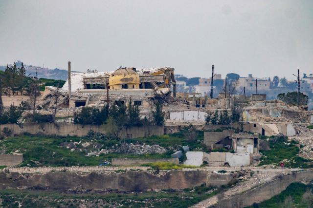 TOPSHOT - Destroyed buildings are seen in the Lebanese village of Yaroun from a vantage point in the Upper Galilee in northern Israel on the border with Lebanon on March 13, 2026. The Israeli defence minister on March 13, said Lebanon will suffer increasing damage to its infrastructure as Israel targets Hezbollah, after the military destroyed a bridge over the southern Litani river. (Photo by Odd ANDERSEN / AFP) / 
