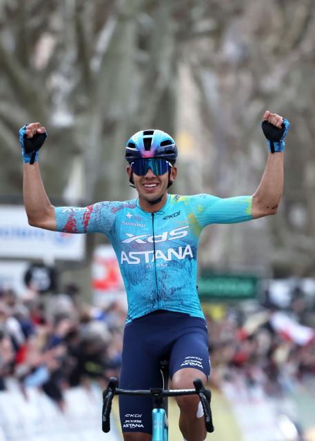 XDS Astana Team's Colombian rider Harold Tejada celebrates as he crosses the finish line to win the 6th stage of the Paris-Nice cycling race, 179.3 km between Barbentane and Apt, on March 13, 2026. (Photo by Anne-Christine POUJOULAT / AFP)