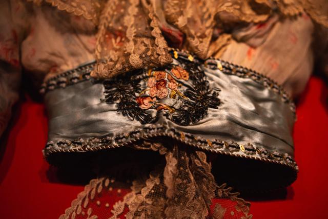 This picture shows a Bodice of an evening down that had belonged to French dancer and model Cleo de Merode (1875-1966), circa 1898-1900, displayed during the exhibition "Fashion in the 18th Century, A Fantasized Legacy" at the Galliera Palais fashion museum in Paris on March 13, 2026. The exhibition runs from March 14, 2026, to July 12, 2026. (Photo by Dimitar DILKOFF / AFP)