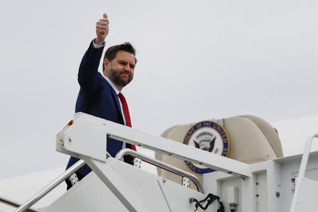 US Vice President JD Vance gives a thumbs up as he boards Air Force Two on March 13, 2026 at Joint Base Andrews, Maryland. Vance is traveling to North Carolina to deliver remarks on the Trump administration's economic agenda. (Photo by Kent Nishimura / POOL / AFP)