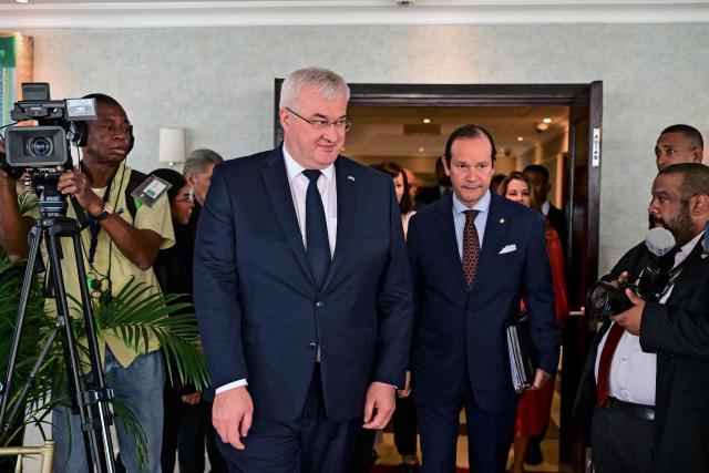Ukraine’s Minister of Foreign Affairs, Andrii Sybiha (L), walks with Panama’s Foreign Minister, Javier Martinez-Acha, at the Ministry of Foreign Affairs in Panama City on March 13, 2026. During the meeting, the two ministers signed several cooperation agreements. (Photo by MARTIN BERNETTI / AFP)