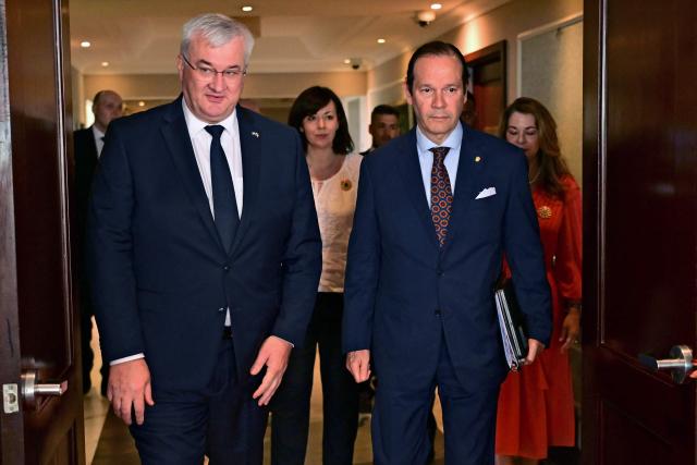 Ukraine’s Minister of Foreign Affairs, Andrii Sybiha (L), walks with Panama’s Foreign Minister, Javier Martinez-Acha, at the Ministry of Foreign Affairs in Panama City on March 13, 2026. During the meeting, the two ministers signed several cooperation agreements. (Photo by MARTIN BERNETTI / AFP)