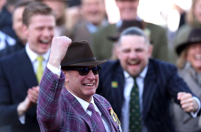 Rich Ricci (C) celebrates after his horse Gaelic Warrior ridden by jockey Paul Townend won the Gold Cup chase horse race on the fourth day of the Cheltenham Festival at Cheltenham Racecourse, in Cheltenham, western England on March 13, 2026. (Photo by Adrian Dennis / AFP)