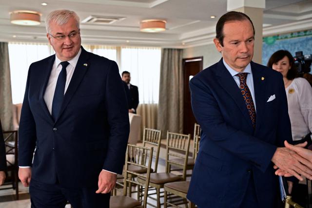 Ukraine’s Minister of Foreign Affairs, Andrii Sybiha (L), walks with Panama’s Foreign Minister, Javier Martinez-Acha, at the Ministry of Foreign Affairs in Panama City on March 13, 2026. During the meeting, the two ministers signed several cooperation agreements. (Photo by MARTIN BERNETTI / AFP)