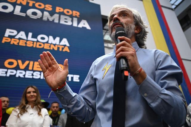 Colombia's vice-presidential candidate for the conservative Democratic Centre party, Juan Daniel Oviedo speaks during a rally after registering his candidacy, in Bogota, on March 12, 2026. Colombia will hold presidential elections on May 31, 2026. (Photo by RAUL ARBOLEDA / AFP)