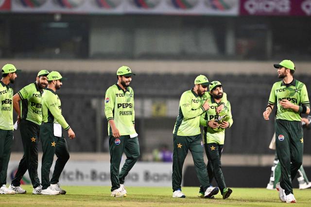 Pakistan's cricketers celebrate after winning the second one-day international (ODI) cricket match between Bangladesh and Pakistan at Sher-e-Bangla National Stadium in Mirpur on March 13, 2026. (Photo by MUNIR UZ ZAMAN / AFP)