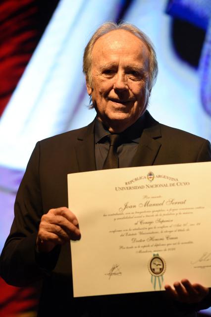Spanish singer-songwriter Joan Manuel Serrat receives an honorary doctorate from the National University of Cuyo during a ceremony at the Nave UNCuyo complex in Mendoza, Argentina, on March 13, 2026. (Photo by Andres Larrovere / AFP)